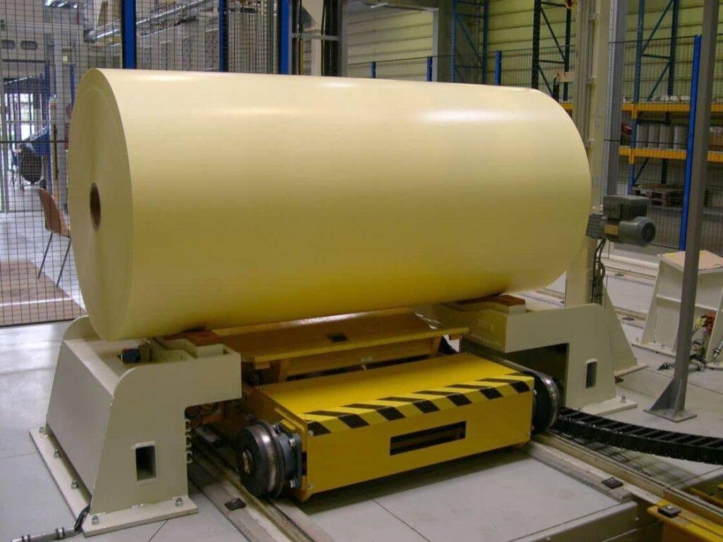 Paper reel positioned on a handling trolley